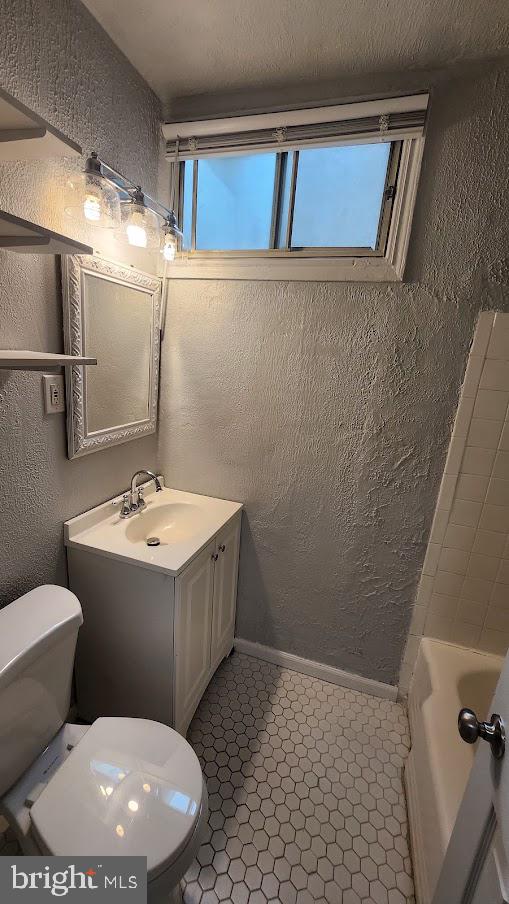 1422 W Street Southeast, Unit 2 Washington, DC 20020 - Photo 8 of 12 a bathroom with a sink and mirror