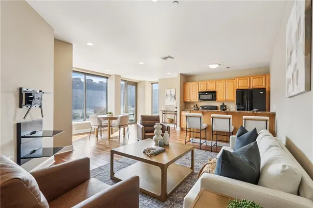 a living room with furniture and a large window