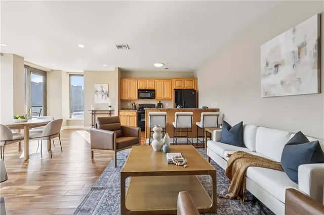 a view of a dining room with furniture window and wooden floor