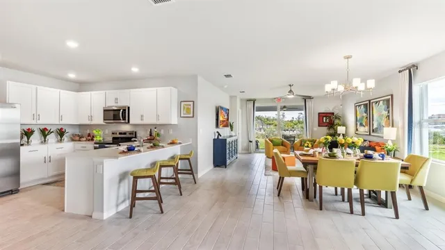 a view of a dining room with furniture window and wooden floor