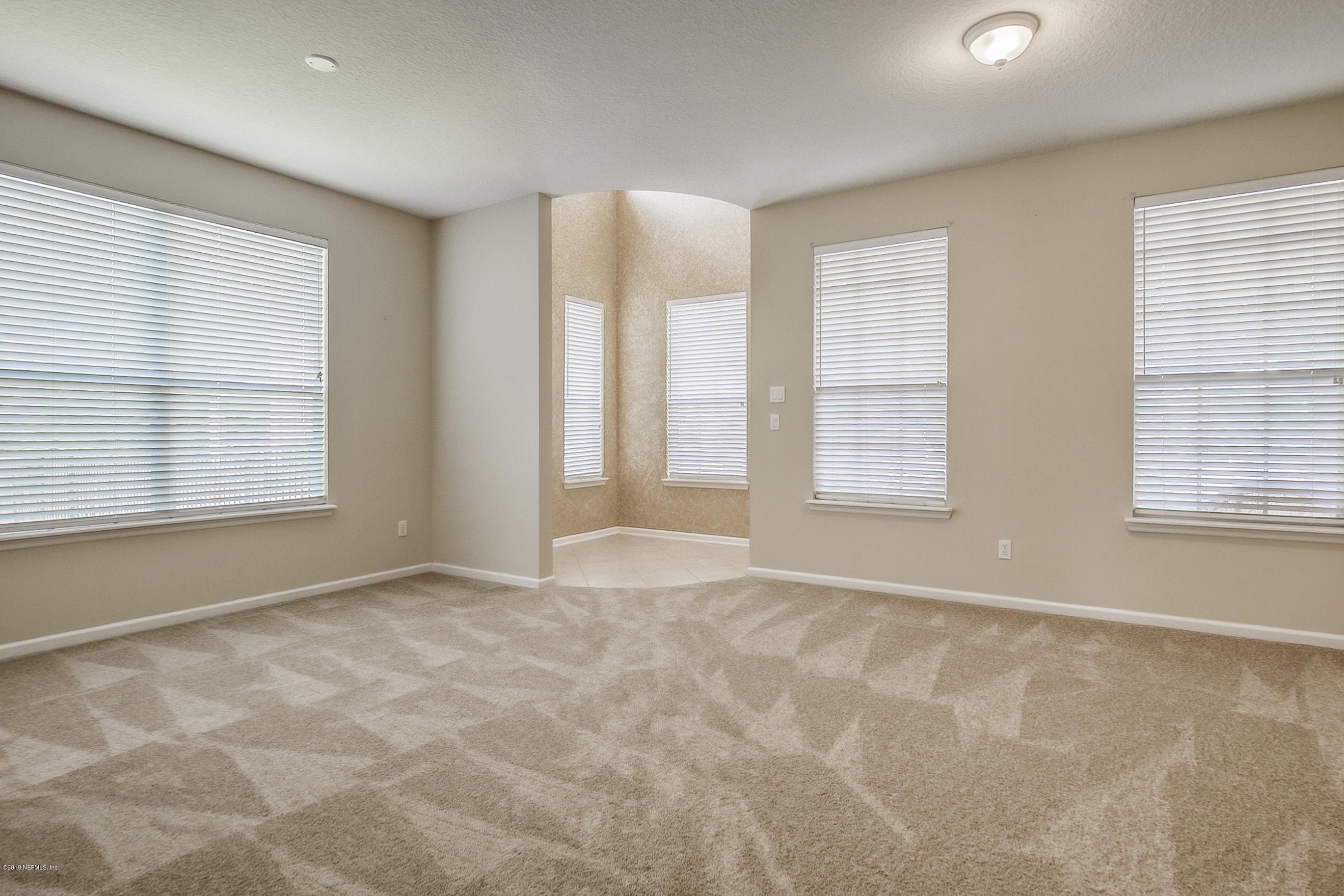3424 South Saxxon Road St. Augustine, FL 32092 - Photo 5 of 75 a view of an empty room with a window