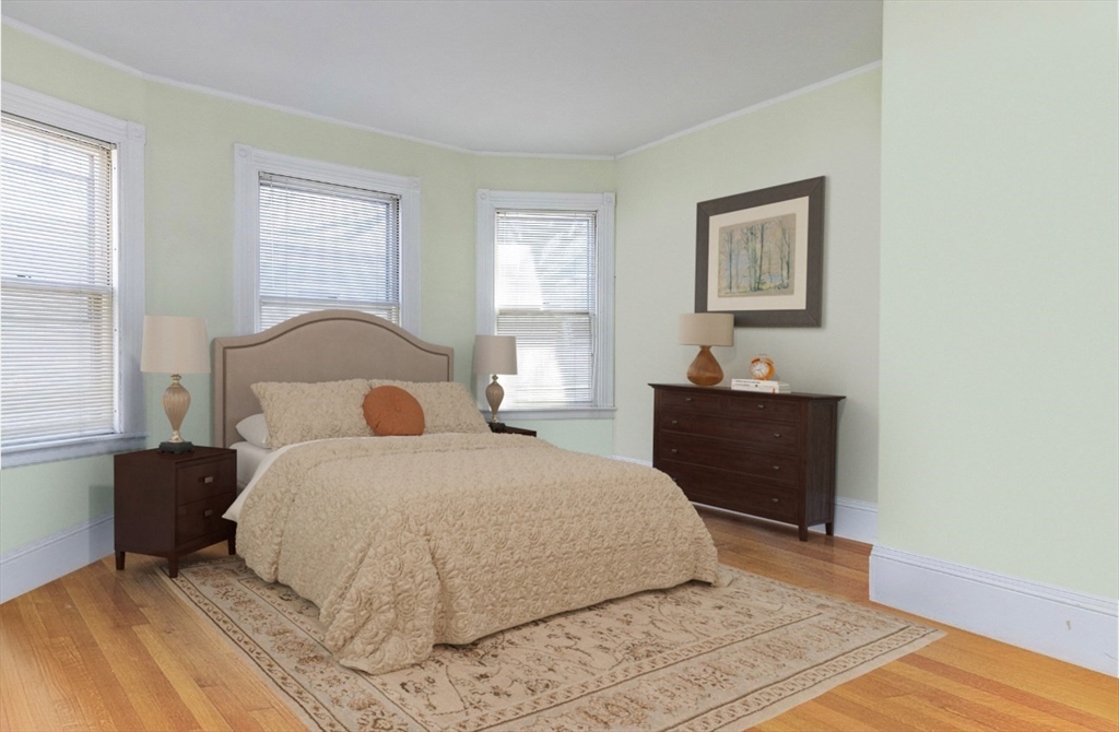 37 Osborne Road Brookline, MA 02446 - Photo 9 of 16 a bedroom with a bed and a window