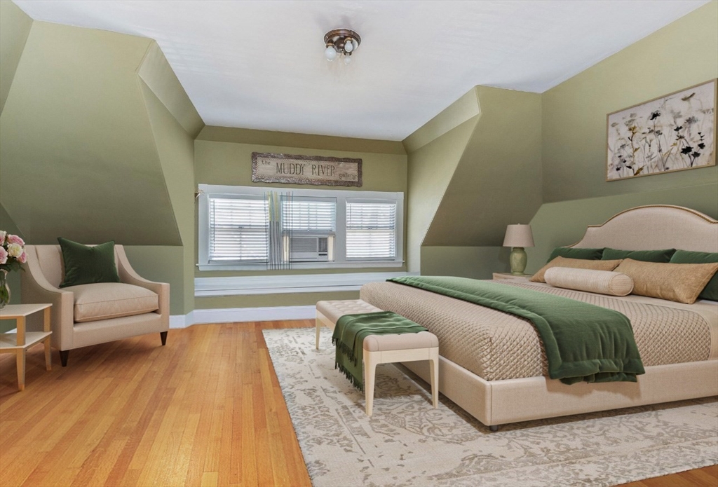 37 Osborne Road Brookline, MA 02446 - Photo 10 of 16 a bedroom with a bed and a couch