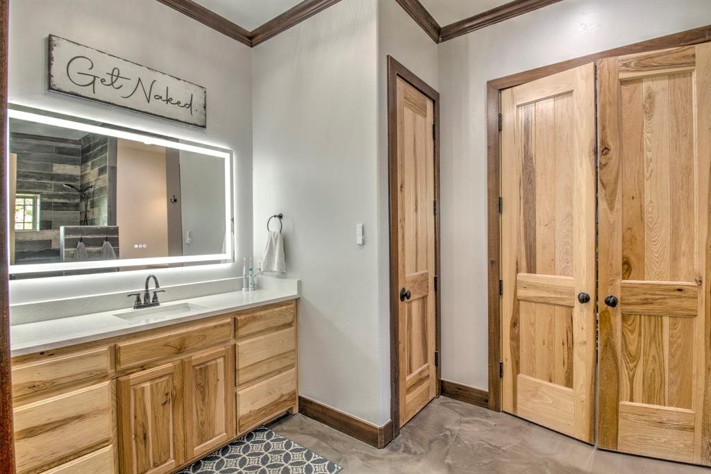 1024 Jordan Creek Road Collinsville, TX 76233 - Photo 13 of 40 The large, state-of-the-art LED mirror provides perfect task lighting while adding a sleek, contemporary glow to the room.