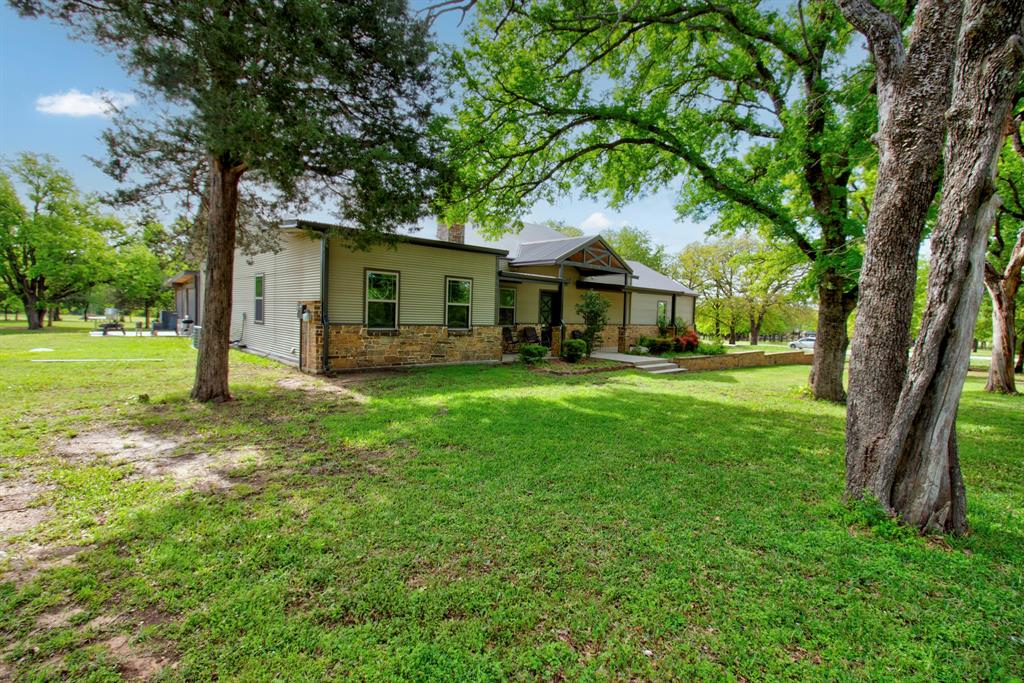 1024 Jordan Creek Road Collinsville, TX 76233 - Photo 2 of 40 Lots of Mature Trees Flood the Property!