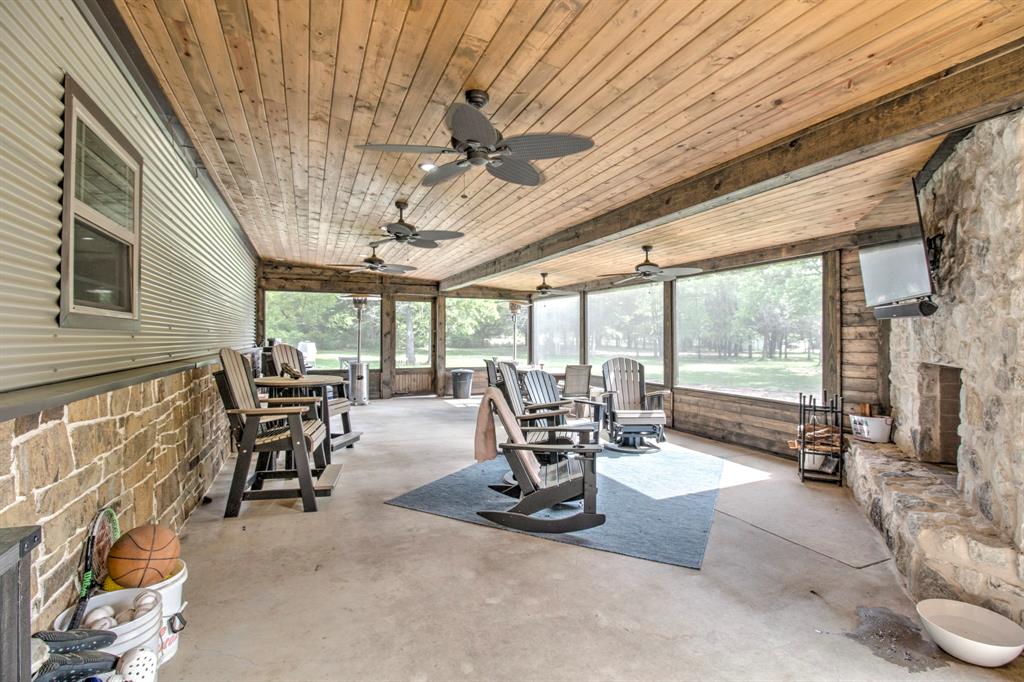 1024 Jordan Creek Road Collinsville, TX 76233 - Photo 21 of 40 This expansive screened-in porch is the ultimate outdoor living retreat, designed for year-round enjoyment and entertaining.