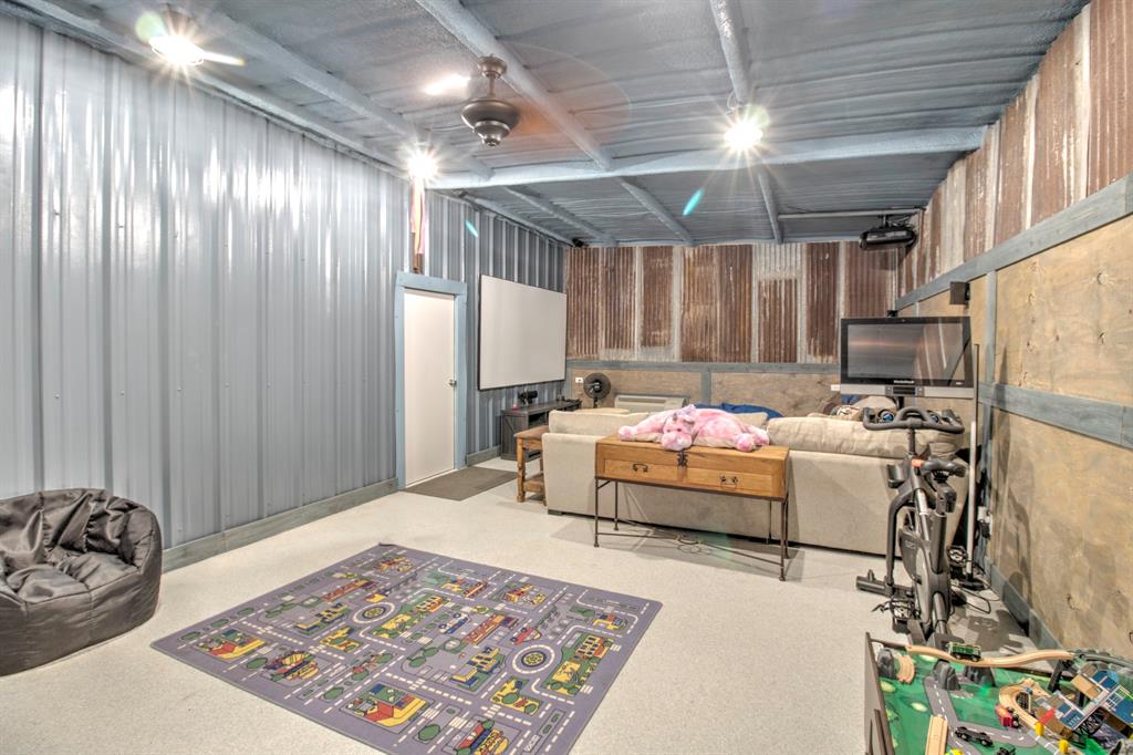 1024 Jordan Creek Road Collinsville, TX 76233 - Photo 31 of 40 Kids Cave in workshop, with media and tons of space for a play area.