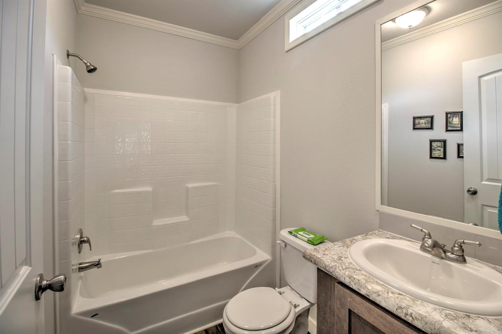 1024 Jordan Creek Road Collinsville, TX 76233 - Photo 40 of 40 Second Bath, with vanity and step in tub/shower.