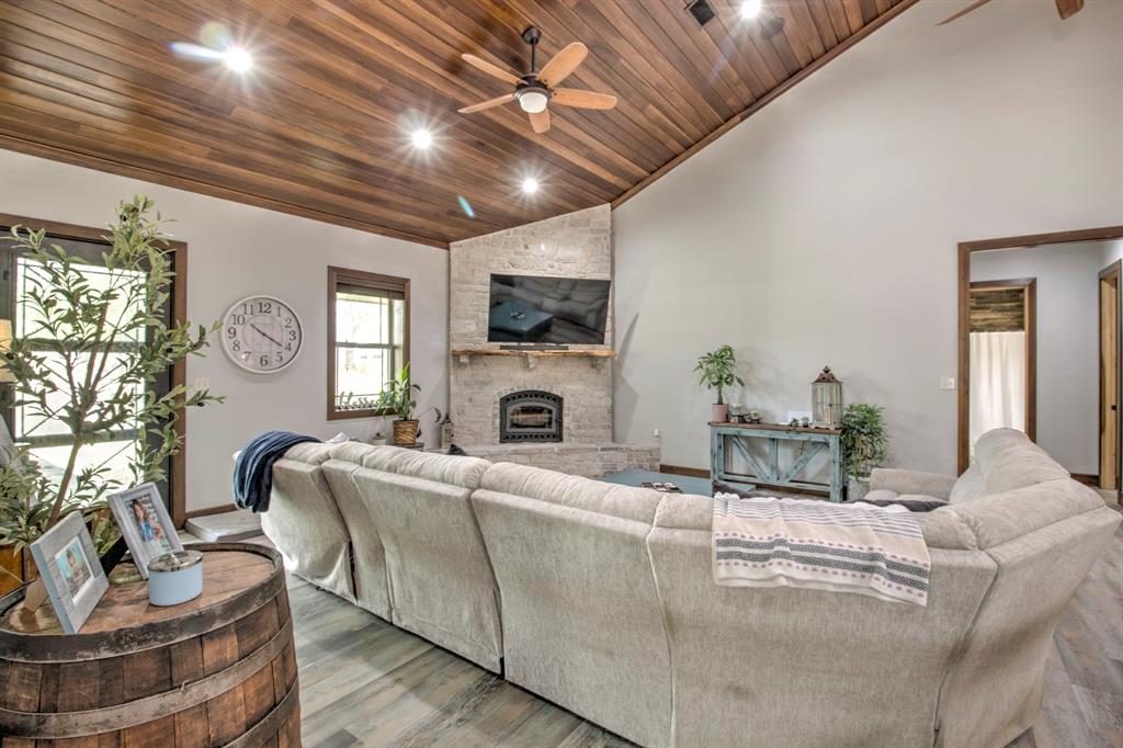 1024 Jordan Creek Road Collinsville, TX 76233 - Photo 5 of 40 Experience the perfect blend of luxury and comfort in this inviting living room.