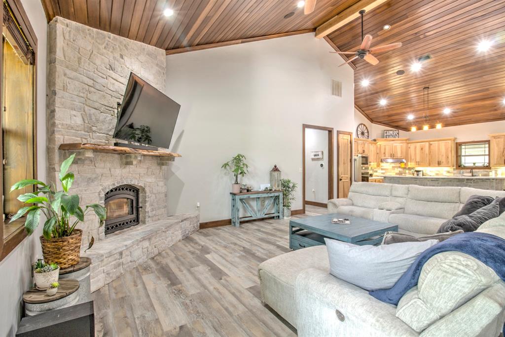 1024 Jordan Creek Road Collinsville, TX 76233 - Photo 6 of 40 Stone Fireplace in the living room, perfect for relaxing and enjoying