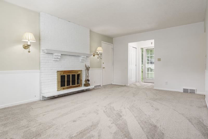5792 Haddon Place Rockford, IL 61114 - Photo 18 of 47 a view of empty room with a fireplace