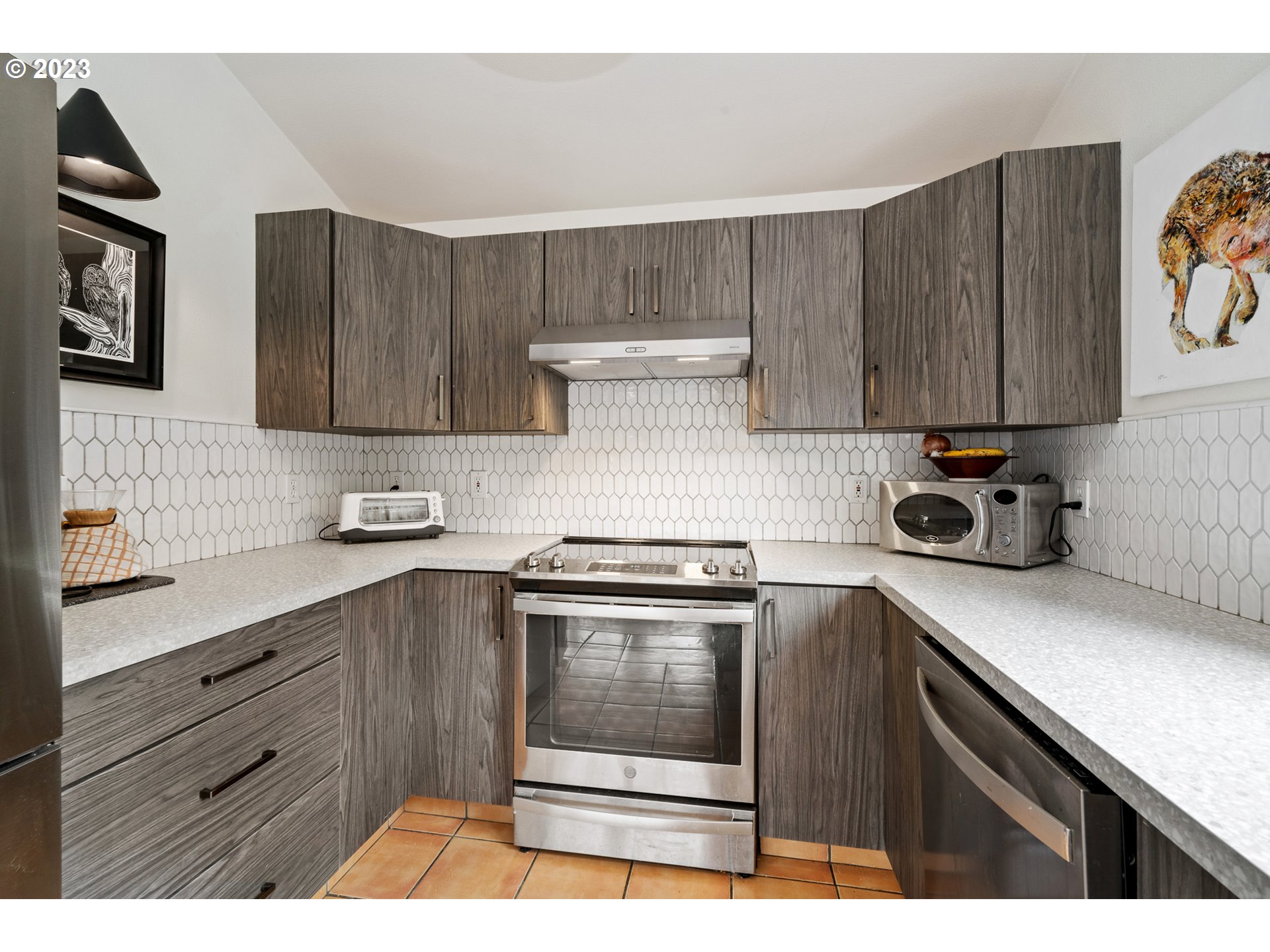 8189 Nehalem Road Manzanita, OR 97130 - Photo 12 of 30 a kitchen with stainless steel appliances a stove a sink and a cabinets