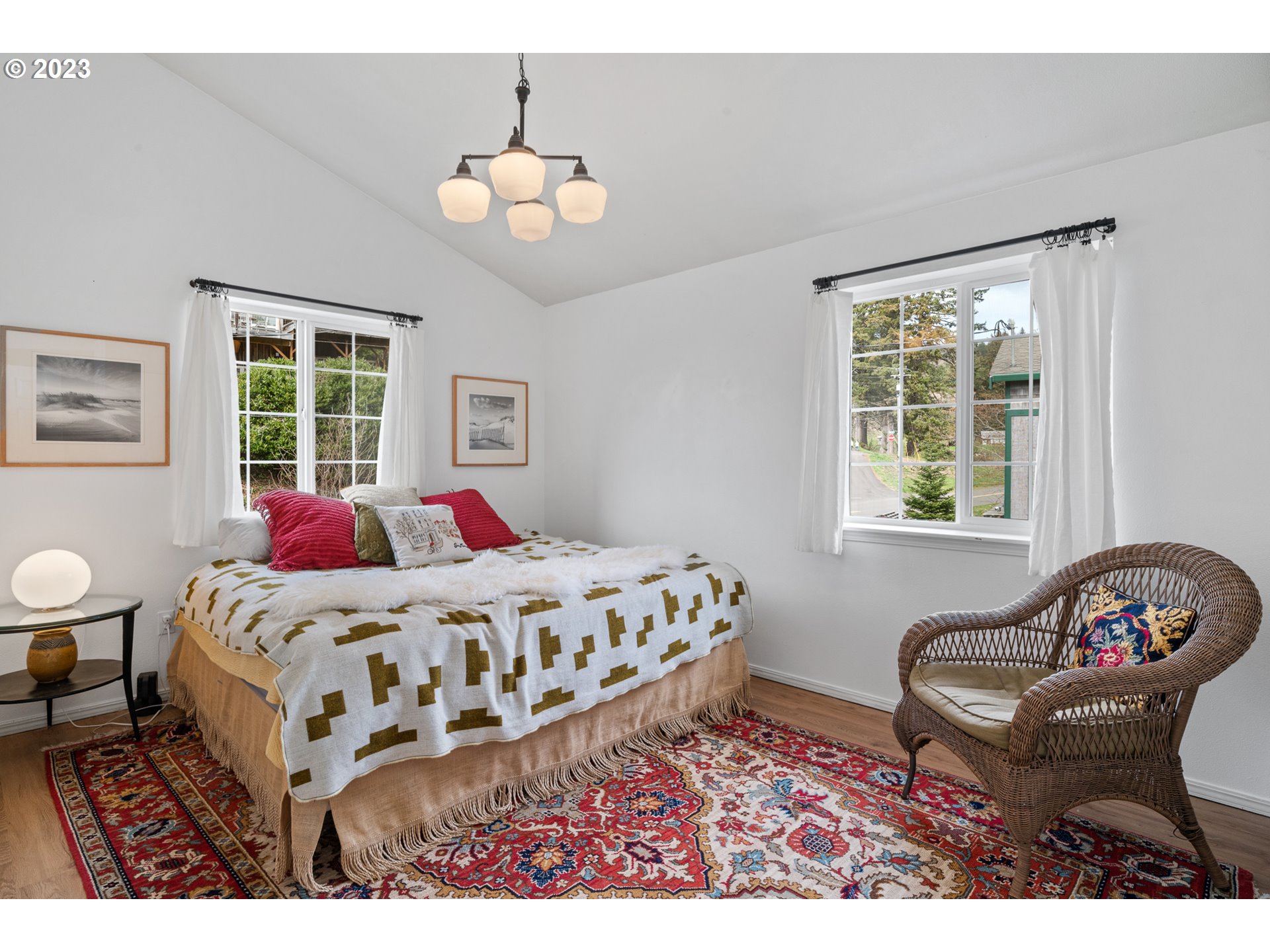 8189 Nehalem Road Manzanita, OR 97130 - Photo 14 of 30 a bed room with a bed and a chair
