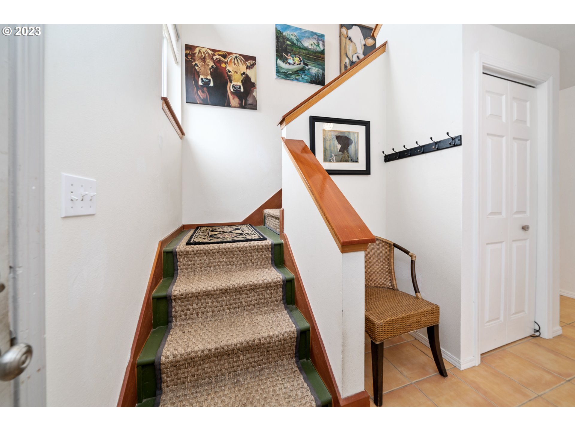 8189 Nehalem Road Manzanita, OR 97130 - Photo 18 of 30 a view of staircase with lots of frames on wall