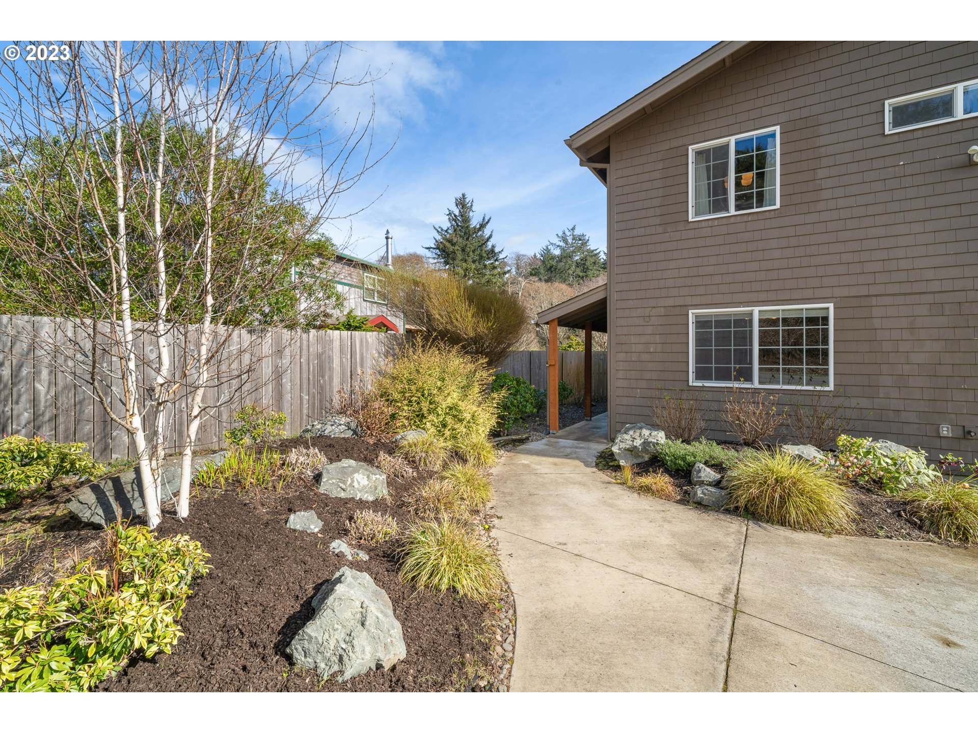 8189 Nehalem Road Manzanita, OR 97130 - Photo 5 of 30 a view of a backyard with a garden