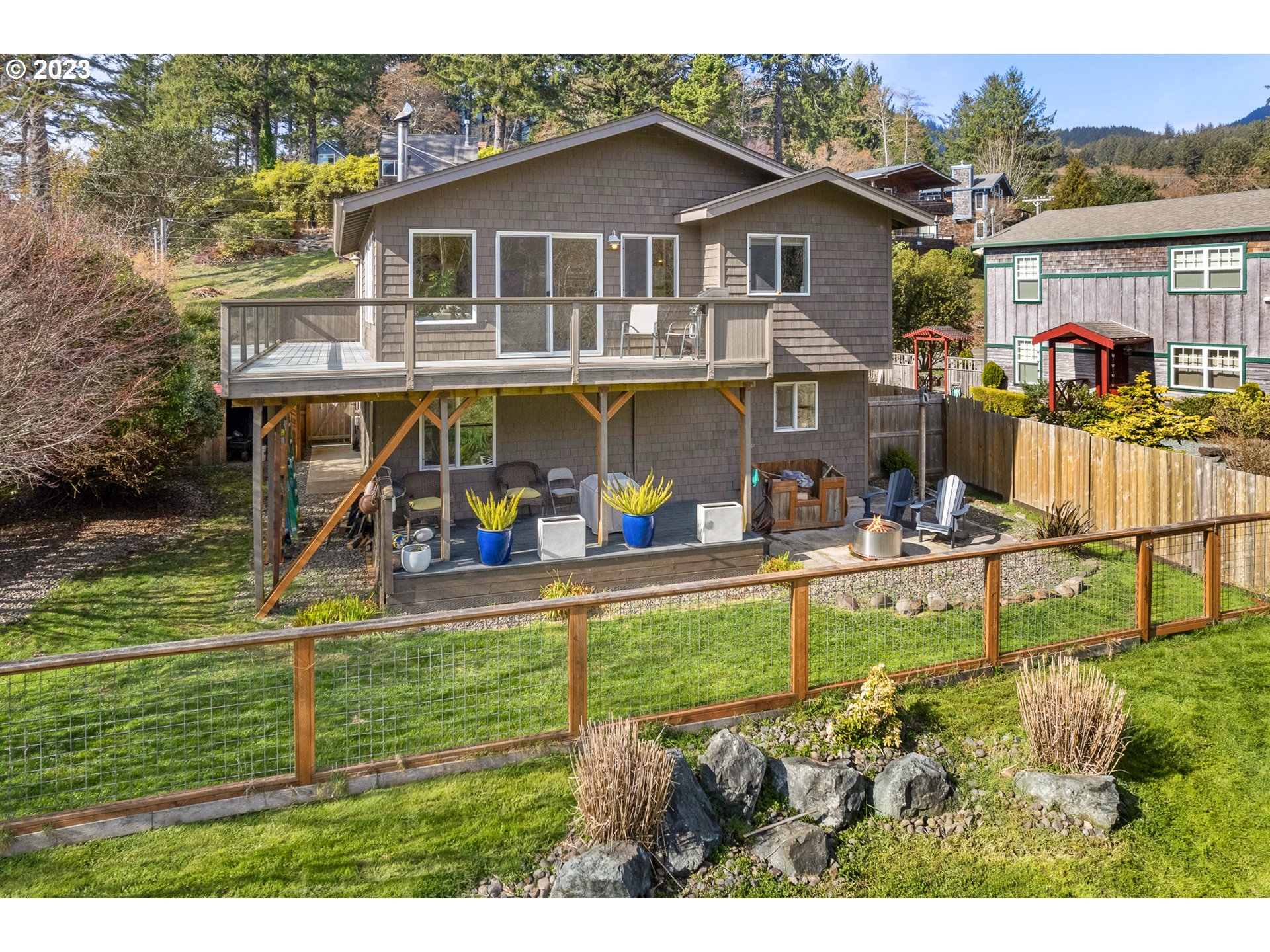 8189 Nehalem Road Manzanita, OR 97130 - Photo 6 of 30 a view of a house with a yard balcony and sitting area