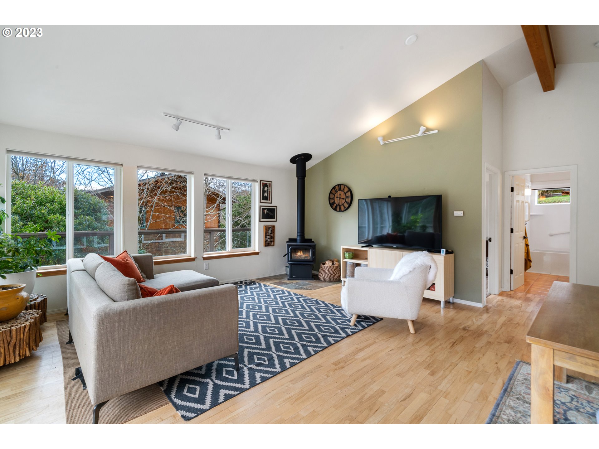 8189 Nehalem Road Manzanita, OR 97130 - Photo 8 of 30 a living room with furniture and large windows