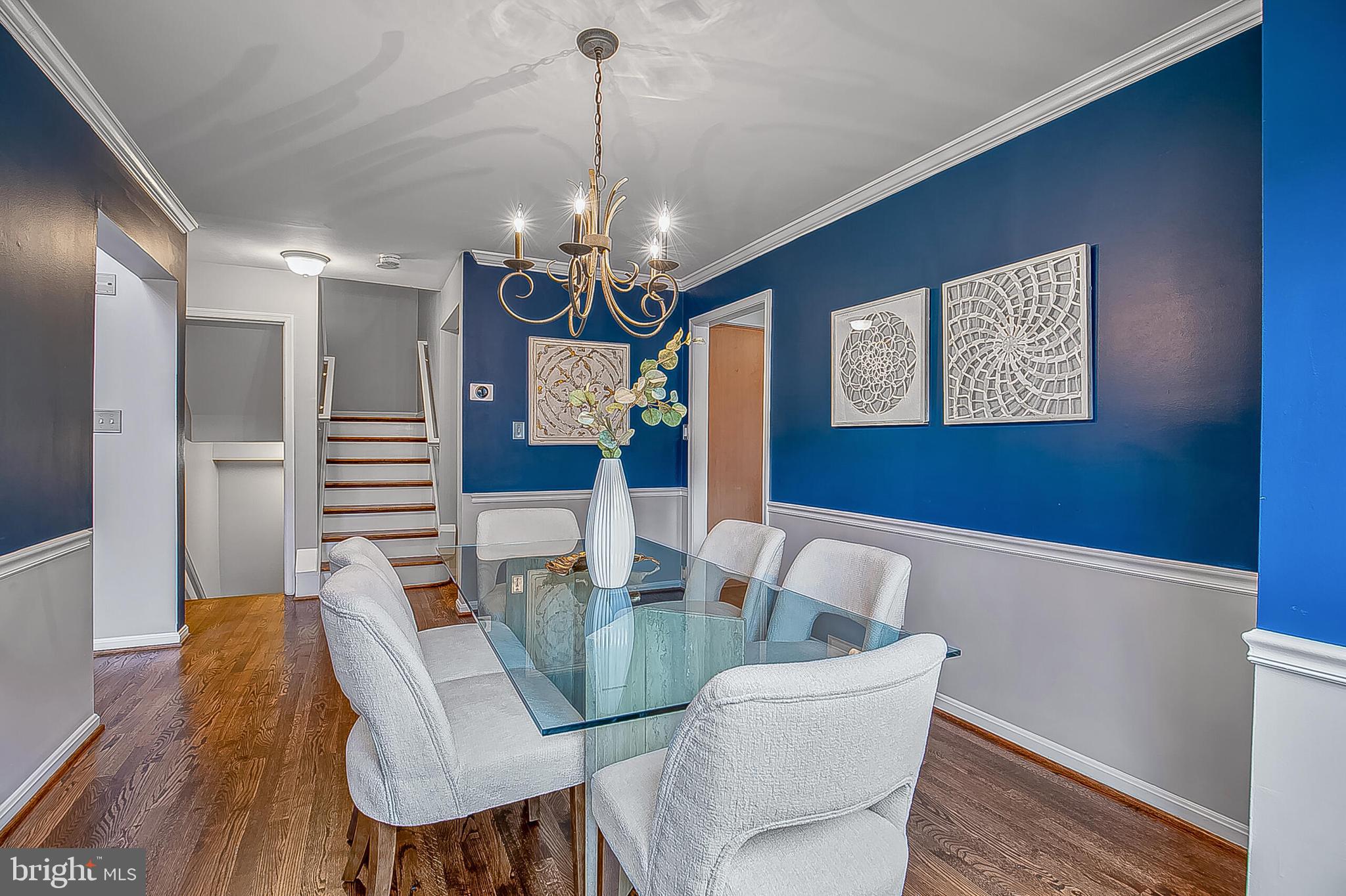 1824 Duffield Lane Alexandria, VA 22307 - Photo 20 of 64 a view of a dining room with furniture a chandelier and wooden floor