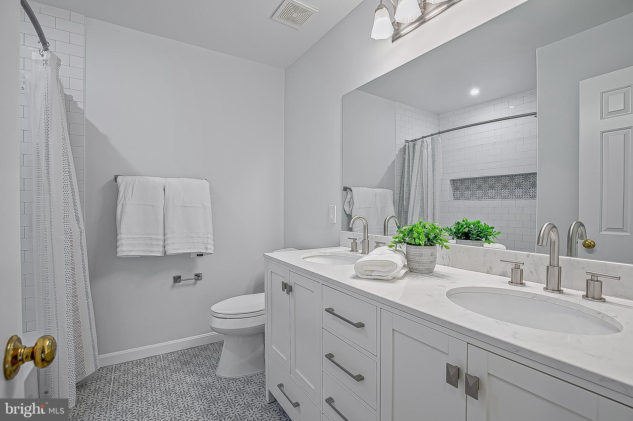 1824 Duffield Lane Alexandria, VA 22307 - Photo 42 of 64 a bathroom with a granite countertop sink mirror and toilet