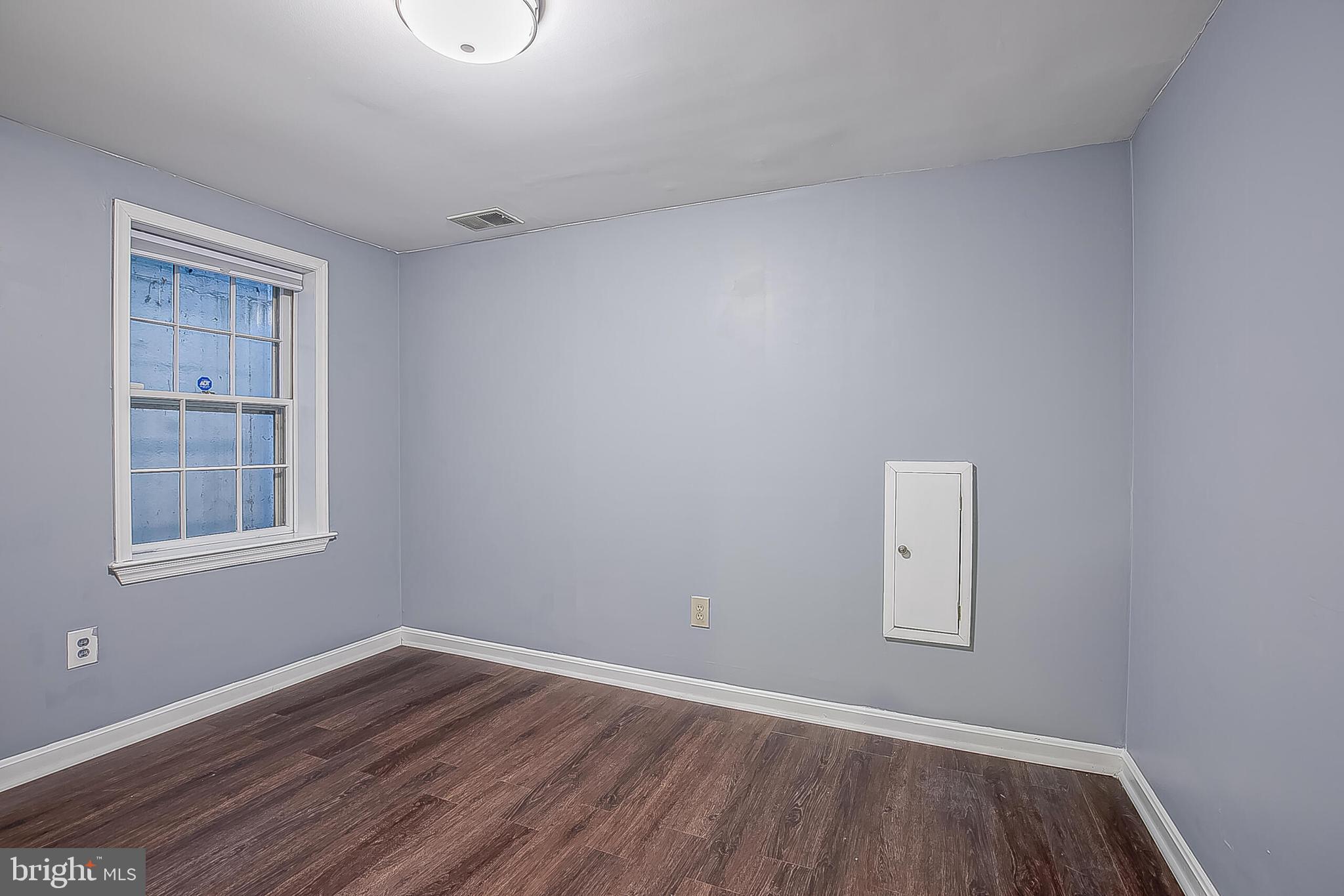 1824 Duffield Lane Alexandria, VA 22307 - Photo 50 of 64 an empty room with wooden floor and windows
