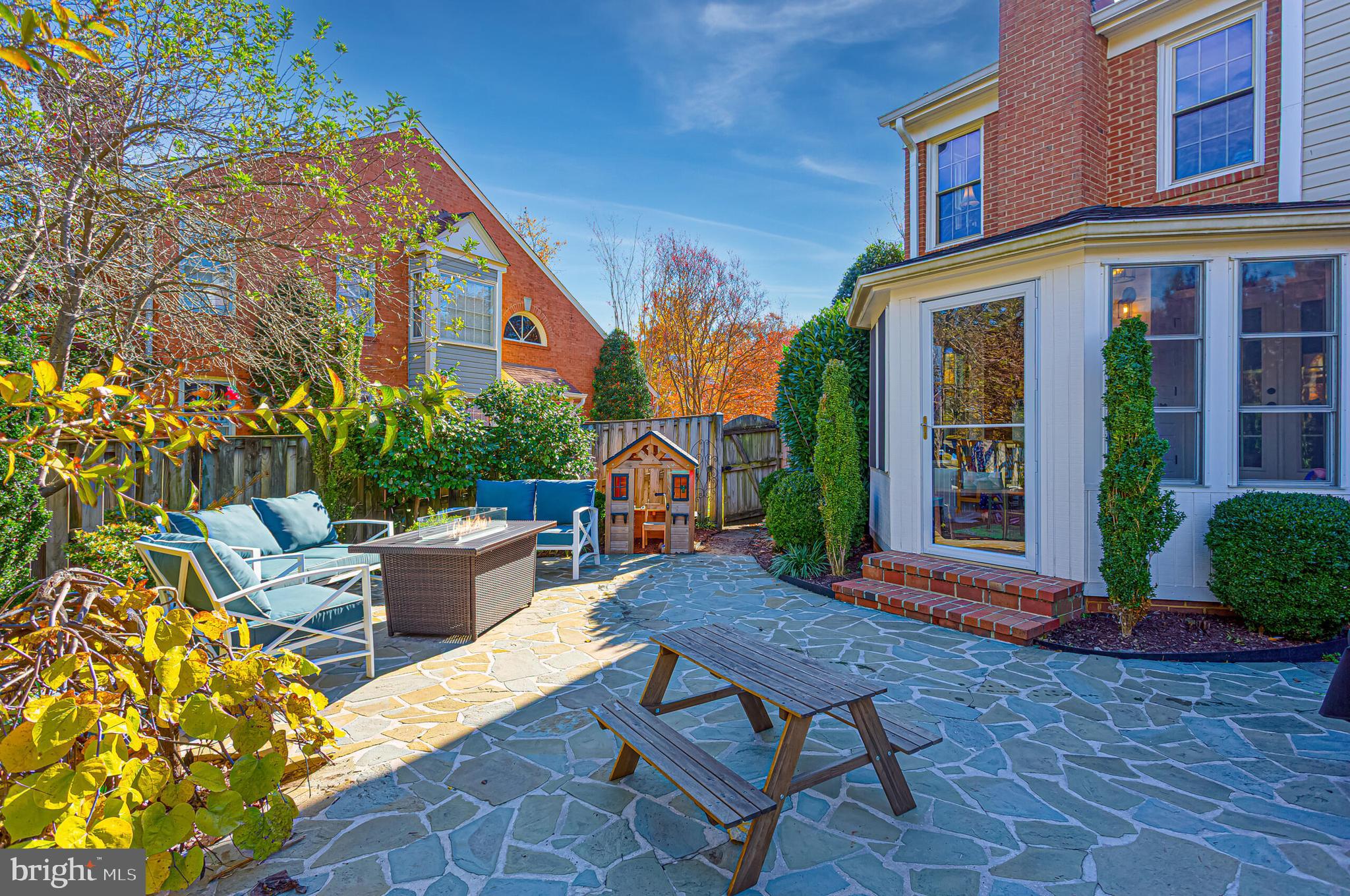 1824 Duffield Lane Alexandria, VA 22307 - Photo 56 of 64 front view of a house with a chairs and table in a patio