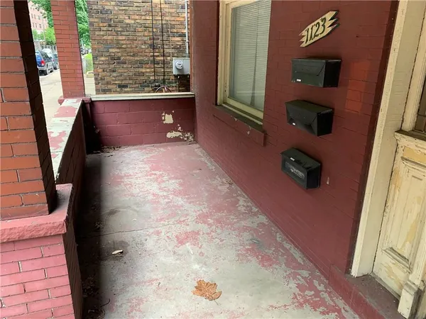 a view of entryway with wooden floor