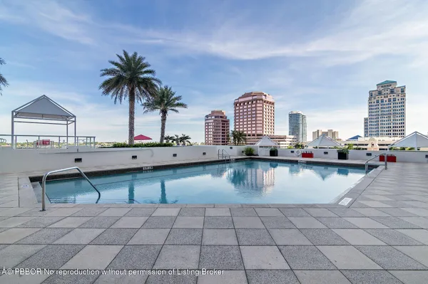 a view of a swimming pool and lounge chair
