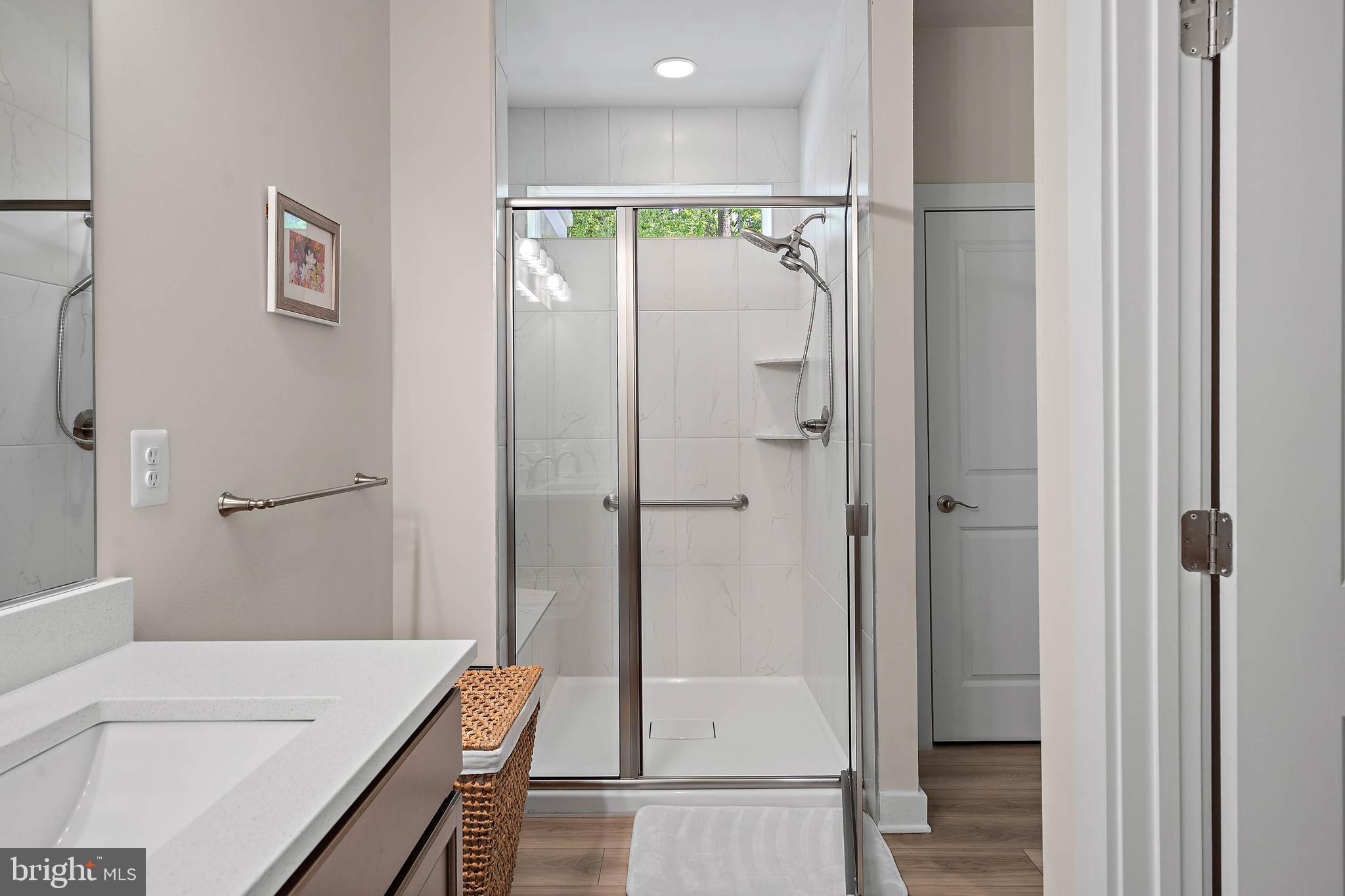 18565 Emerson Way Georgetown, DE 19947 - Photo 20 of 60 a bathroom with a tub and shower