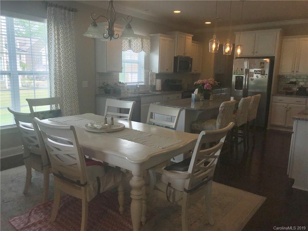 566 Brookhaven Drive, Unit 89 Fort Mill, SC 29708 - Photo 19 of 22 a view of a dining room with furniture