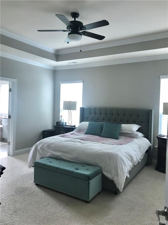566 Brookhaven Drive, Unit 89 Fort Mill, SC 29708 - Photo 8 of 22 a bedroom with a bed and a window
