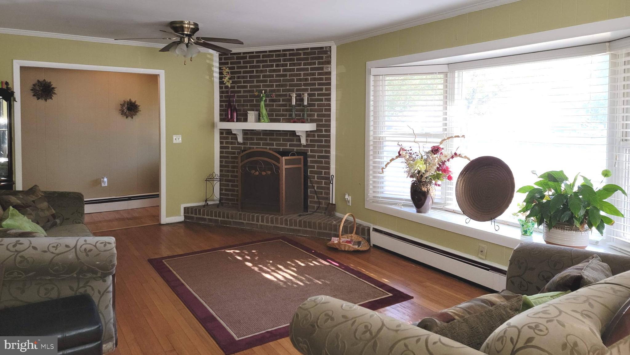 708 Riverside Drive Salisbury, MD 21801 - Photo 8 of 36 Living room w/ fireplace insert.