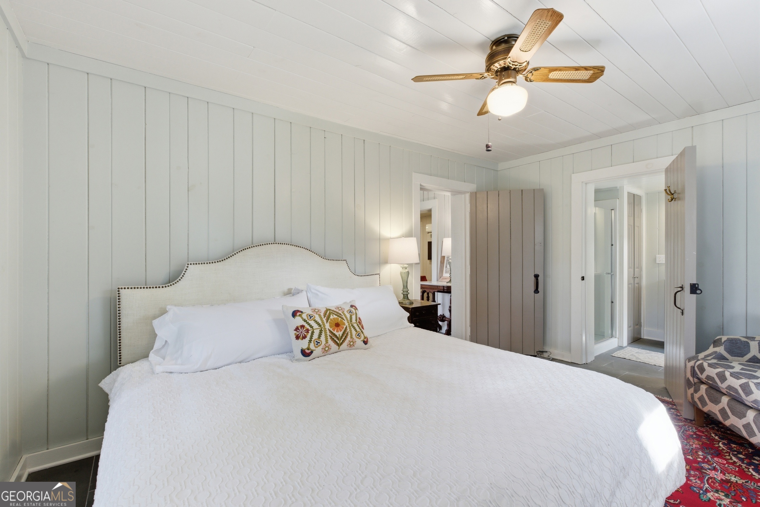 1921 Franklin Road Highlands, NC 28741 - Photo 37 of 72 a bedroom with a bed and a chandelier