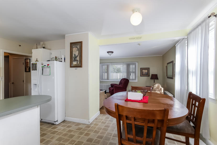 32 Seabrook Road Hyannis, MA 02601 - Photo 12 of 21 a living room with furniture and a table