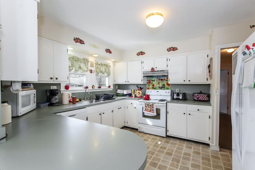 32 Seabrook Road Hyannis, MA 02601 - Photo 13 of 21 a kitchen with cabinets a sink and white appliances