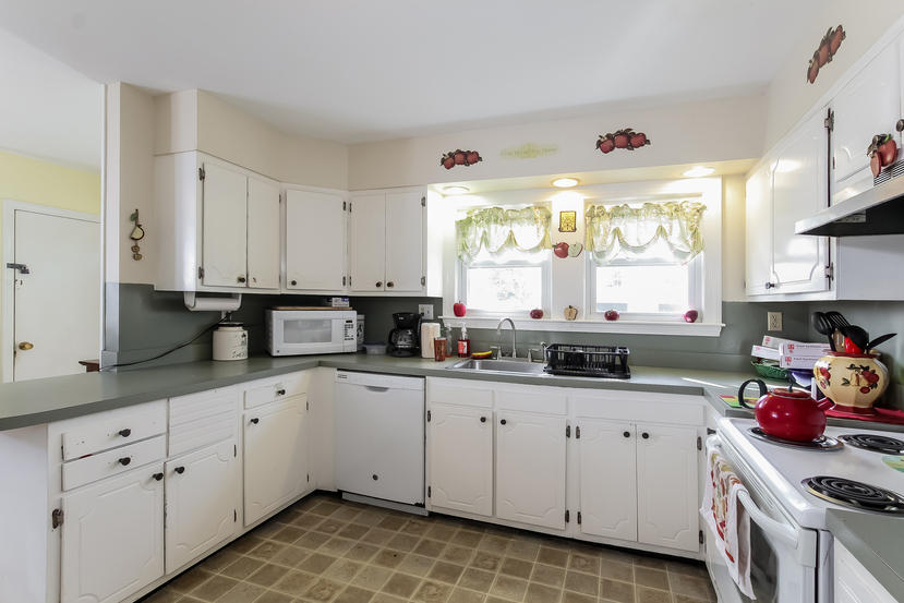 32 Seabrook Road Hyannis, MA 02601 - Photo 14 of 21 a kitchen with granite countertop white cabinets and white appliances