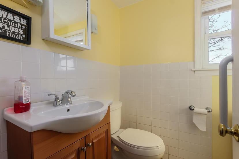 32 Seabrook Road Hyannis, MA 02601 - Photo 19 of 21 a bathroom with a sink a toilet and a mirror