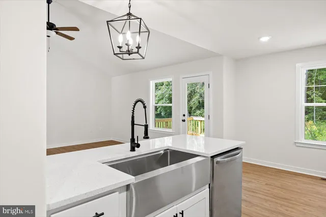 a kitchen with a sink and a refrigerator