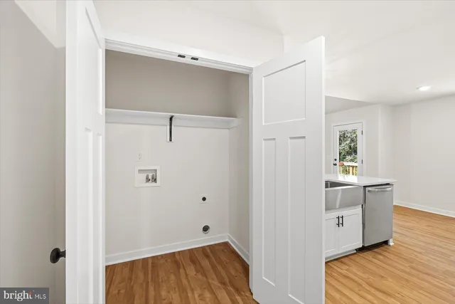 a view of a kitchen with a sink and dishwasher
