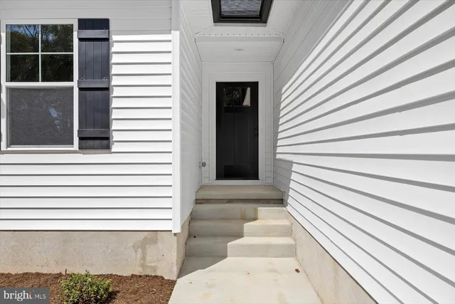 a view of a wooden deck with a yard
