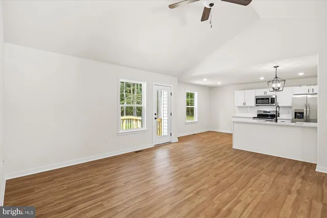 a view of kitchen with wooden floor and window