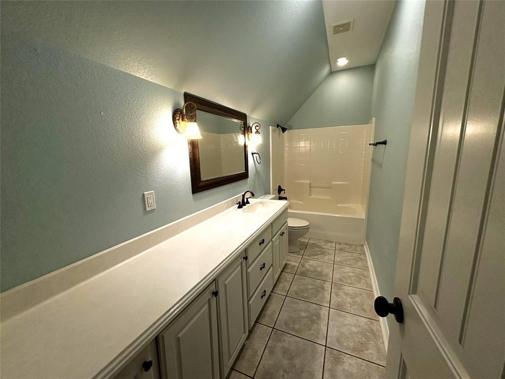 1170 Brazos Loop Gholson, TX 76705 - Photo 28 of 37 Bathroom featuring an extended vanity with dual sinks, white cabinetry, and a large framed mirror