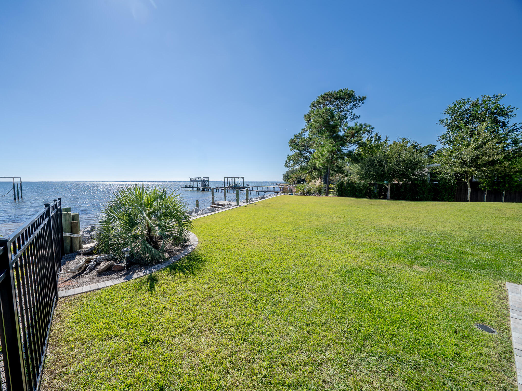 68 Dolphin Place Freeport, FL 32439 - Photo 111 of 118 a view of a garden with a building in the background