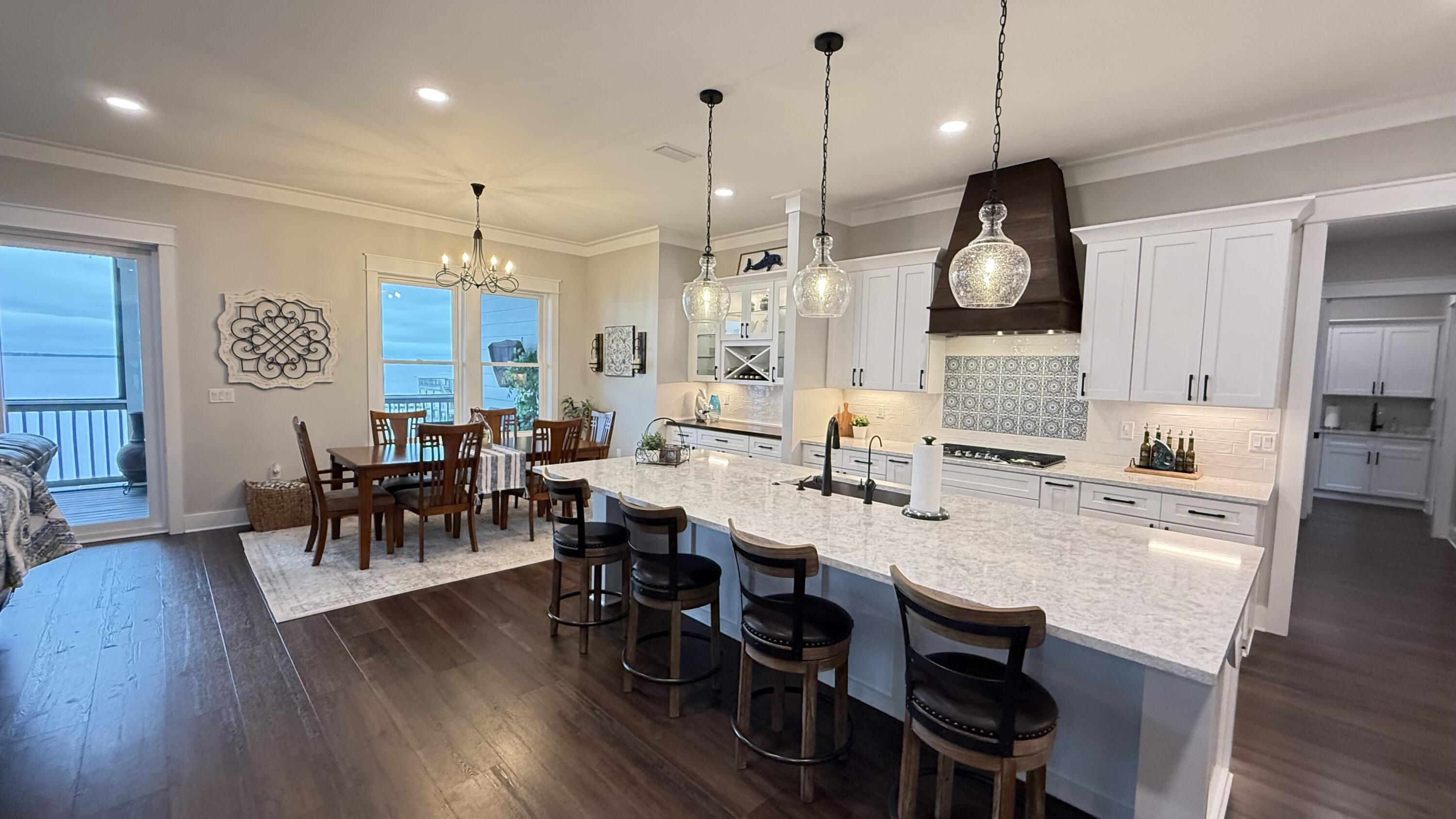 68 Dolphin Place Freeport, FL 32439 - Photo 20 of 118 a large kitchen with a table and chairs