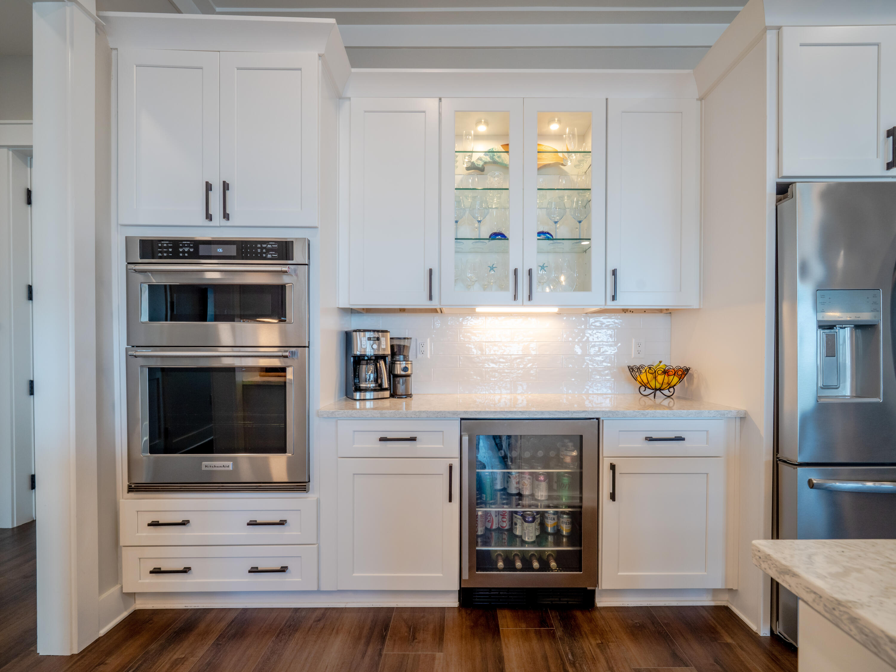 68 Dolphin Place Freeport, FL 32439 - Photo 26 of 118 a kitchen with granite countertop white cabinets and stainless steel appliances