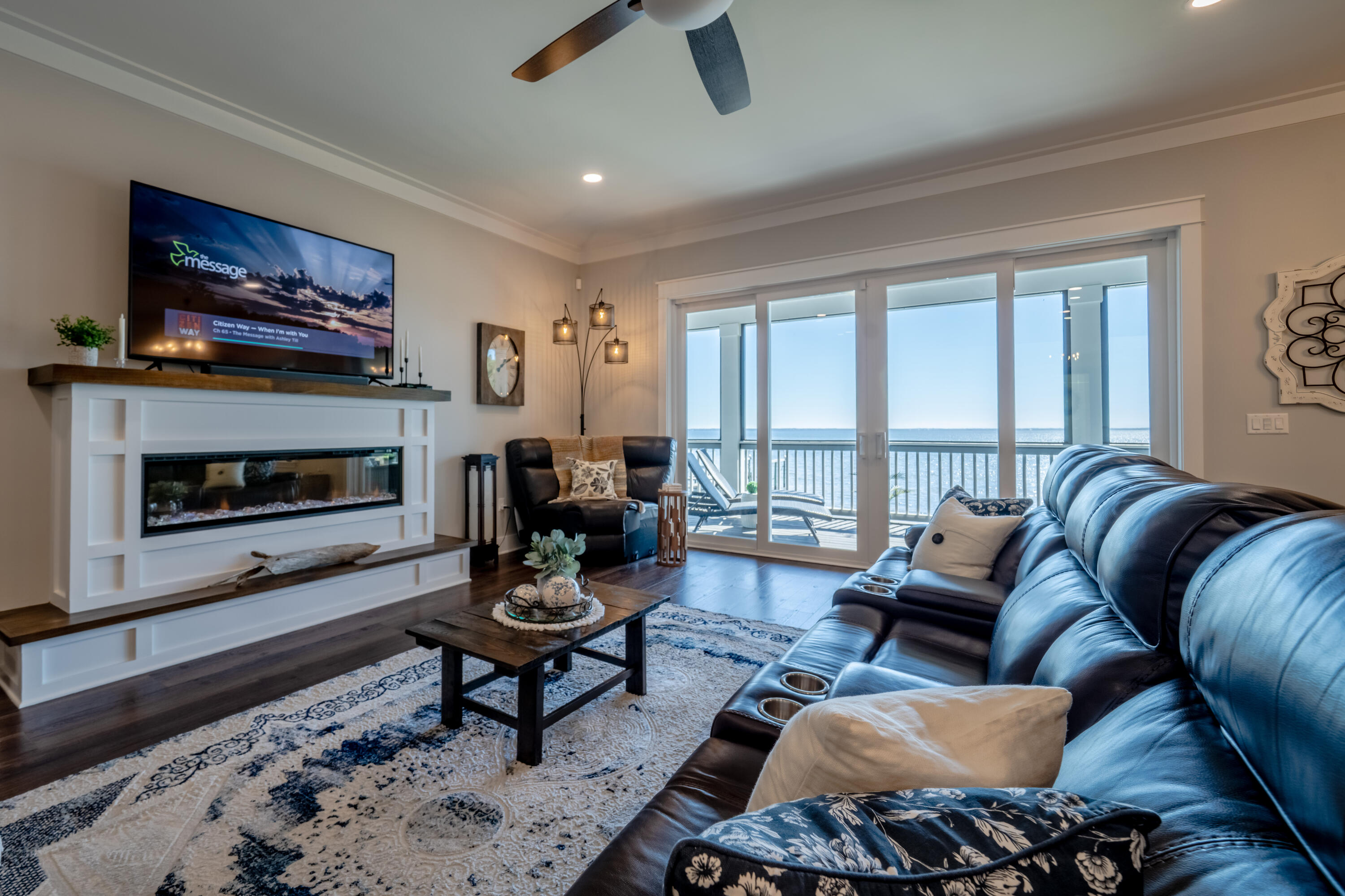 68 Dolphin Place Freeport, FL 32439 - Photo 33 of 118 a living room with furniture a flat screen tv and a fireplace