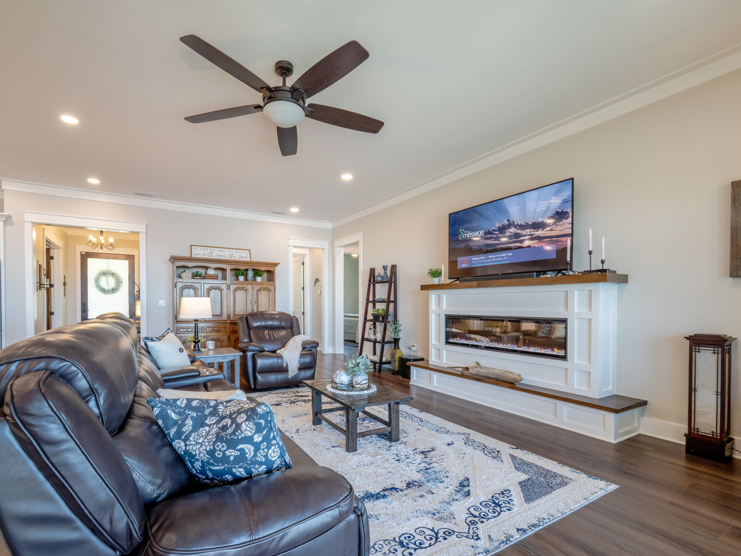 68 Dolphin Place Freeport, FL 32439 - Photo 35 of 118 a living room with furniture a fireplace and a flat screen tv