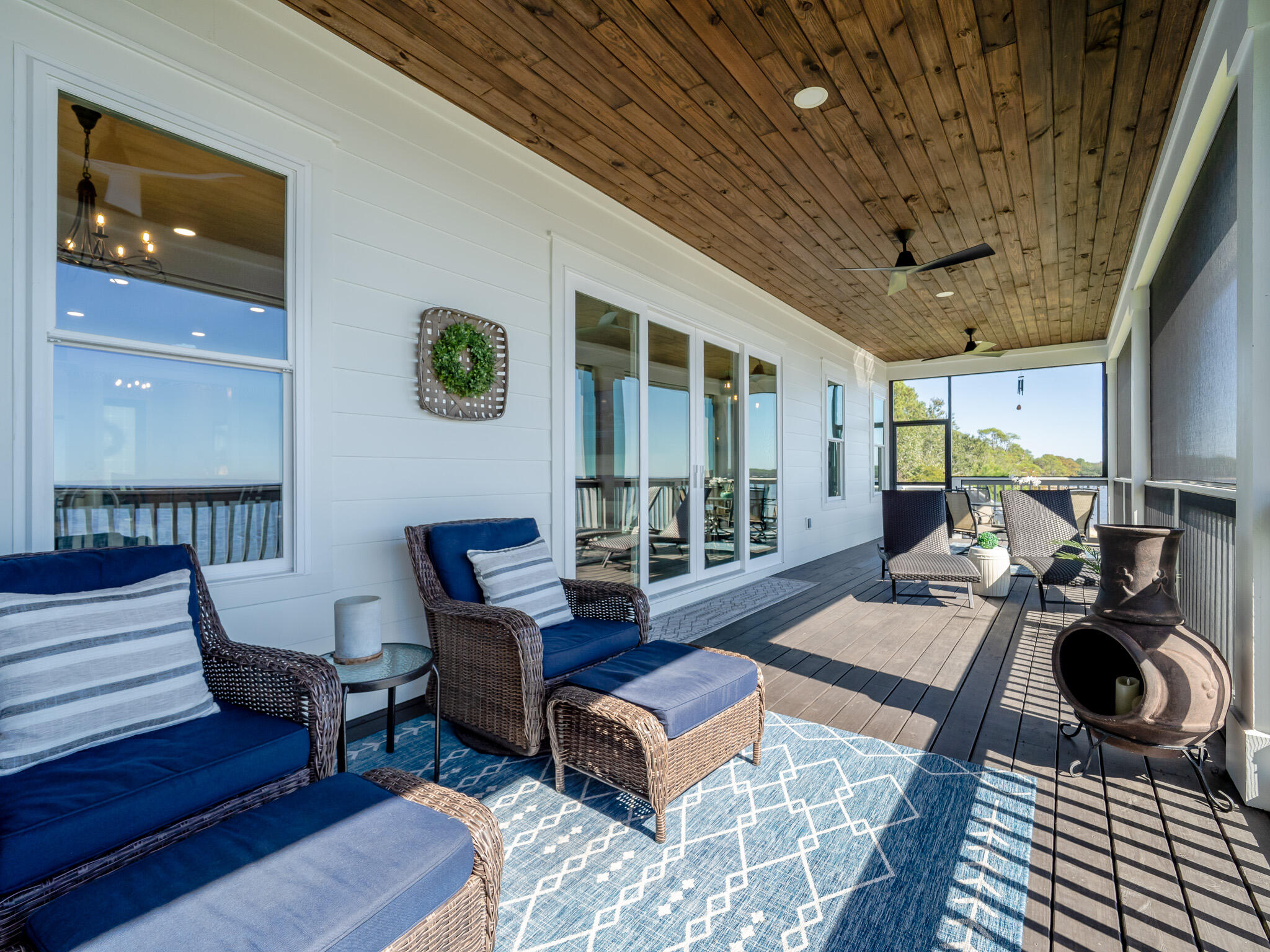 68 Dolphin Place Freeport, FL 32439 - Photo 40 of 118 a living room with furniture a rug and a large window