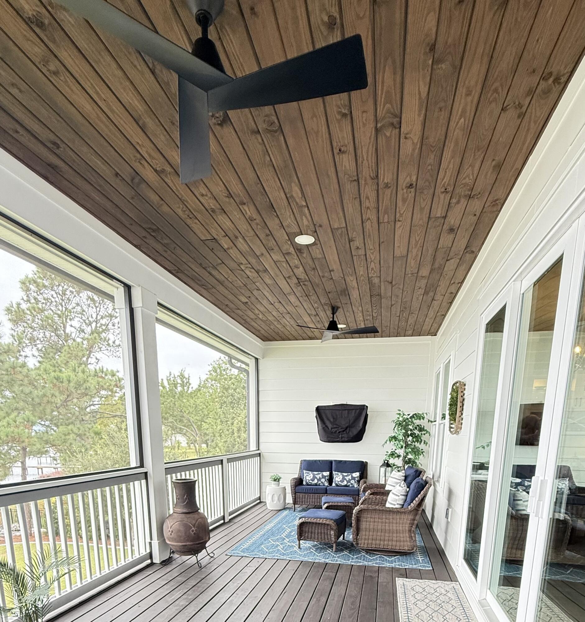 68 Dolphin Place Freeport, FL 32439 - Photo 43 of 118 a view of living room with furniture and floor to ceiling window