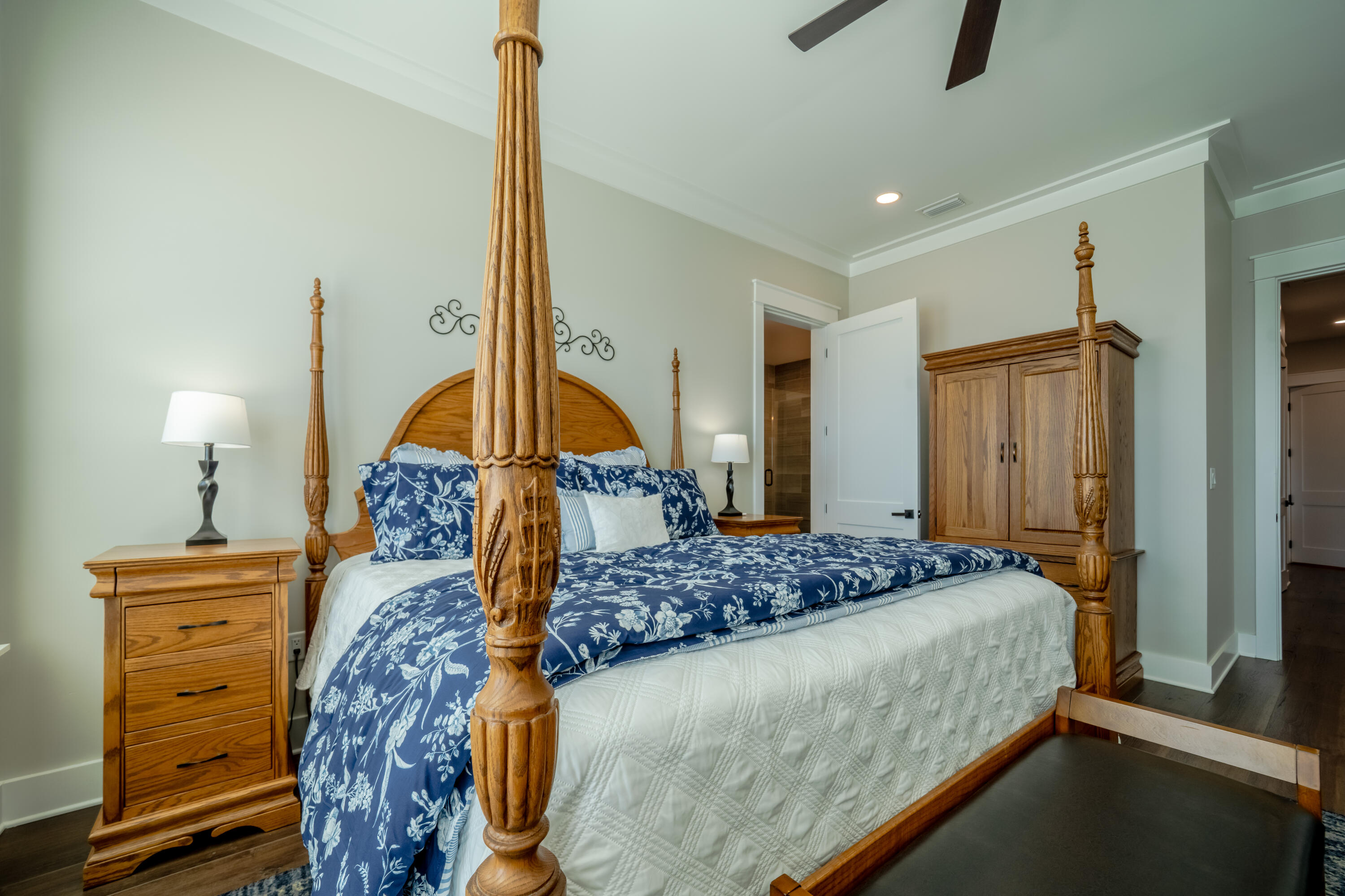 68 Dolphin Place Freeport, FL 32439 - Photo 48 of 118 a bedroom with a bed a dresser and a chandelier