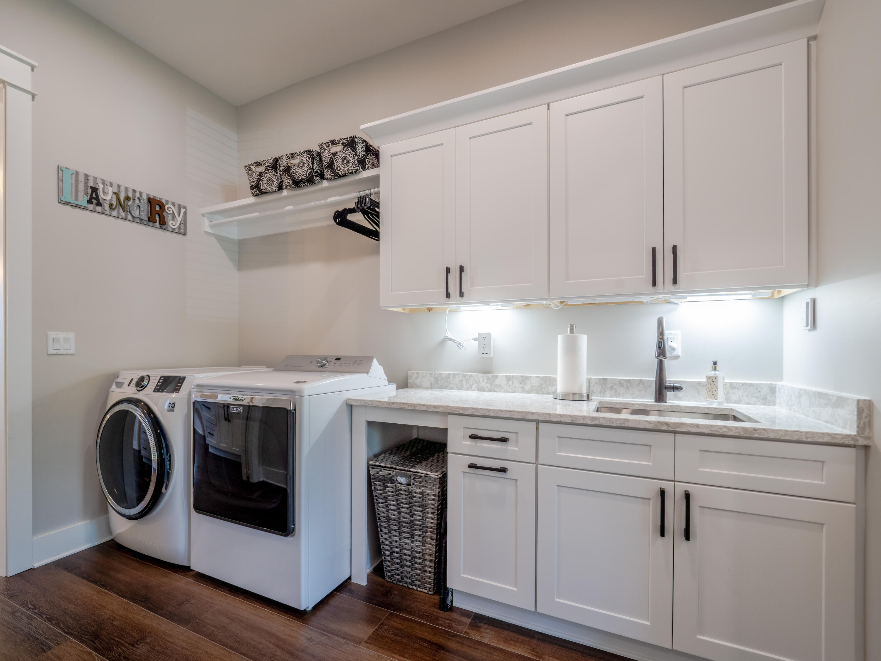 68 Dolphin Place Freeport, FL 32439 - Photo 62 of 118 a utility room with sink dryer and washer